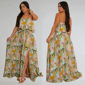 Detail of floral print maxi dress featuring high side slit and yellow tassel drawstring