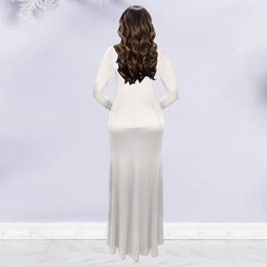Detailed close-up of crystal-embellished cuffs on an elegant white long sleeve mermaid dress