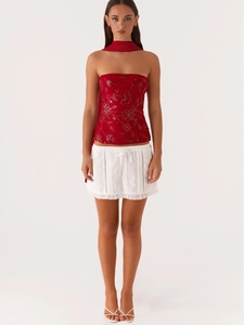 Chic red sequin floral tube top and white lace ruffled mini skirt set with matching scarf