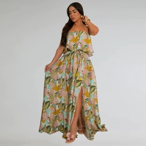 Detail of high side slit and colorful floral print on a bohemian sleeveless maxi dress