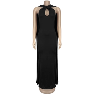 Detail of elegant black halter dress featuring teardrop cutout and flowing back cape drape