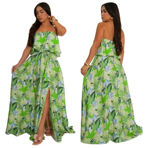 Detail of floral maxi dress featuring side slit and green tassel drawstring waist