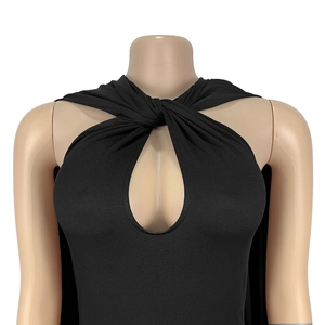 Detail of elegant black halter top featuring a neck twist and keyhole cutout design
