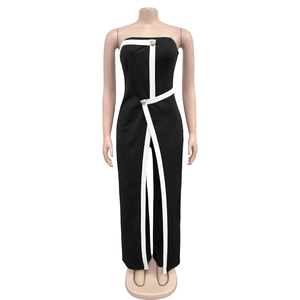 Detail of black strapless jumpsuit with white trim and decorative gold buttons