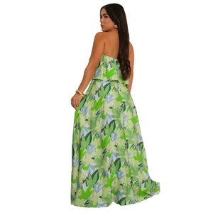Detailed view of the back of a green floral maxi dress featuring a chic side slit design