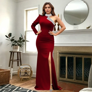 Detail of burgundy off-shoulder evening dress featuring shimmering silver sequins on the sleeve