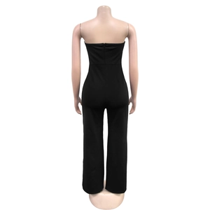 Detail view of the seamless back zipper on a black strapless wide-leg jumpsuit