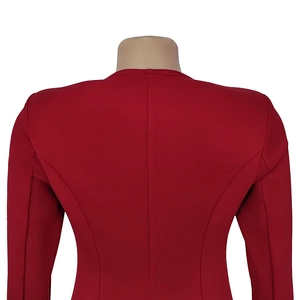 Back view of red slim-fit blazer with princess seams and structured shoulder pads