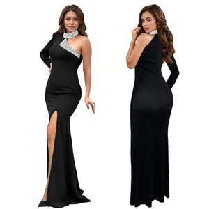 Detail of elegant black off-shoulder maxi dress featuring silver sequins and high slit