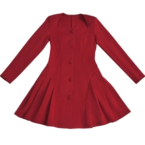 Detail of red deep V-neck dress with long sleeves and buttons on a white background