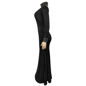 Detail of silver rhinestones on the neckline and sleeves of this black fishtail dress