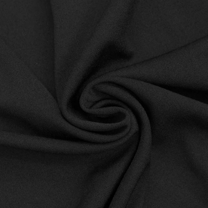 Detailed macro shot of elegant black sheer fabric with soft texture and refined drapes