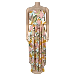 Detail view of the tropical floral print on a strapless sleeveless summer maxi dress