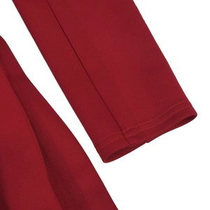 Detail view of the deep red dress sleeve with high-quality flat double-stitch sewing