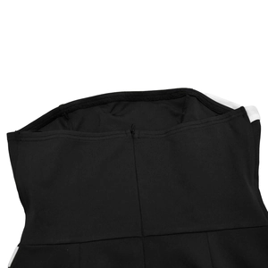 Close-up of seamless invisible zipper and black and white contrast on the back of the jumpsuit