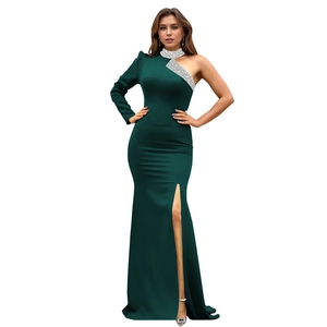 Detailed close-up of dark green satin dress with sparkling silver sequins and high side slit