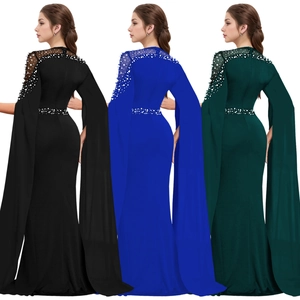 Detailed rhinestone and pearl embellishments on cape sleeve evening gown dress