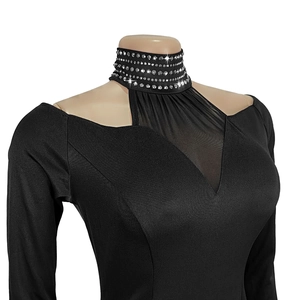 Detail of black rhinestone neckline and mesh paneling on elegant cold-shoulder dress