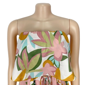 Detail view of tropical floral print strapless dress with smocked bodice and waist tie