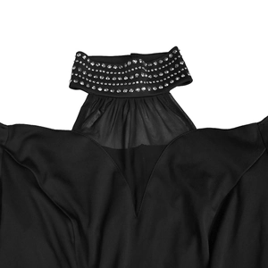 Detail of elegant black dress featuring rhinestone choker neckline and mesh V-insert