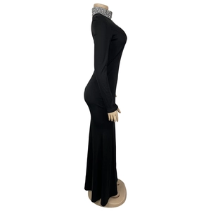 Detail view of the elegant rhinestone collar and high neck design on this black evening gown
