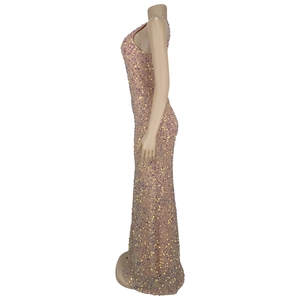 Macro detail of champagne gold sequin evening dress with sparkling laser reflections