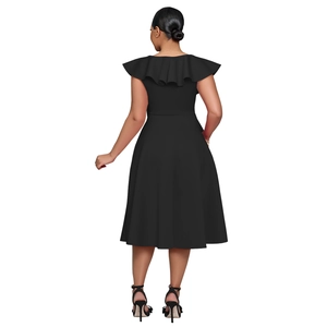Detail view of back cut with elegant ruffles on a black sleeveless party dress