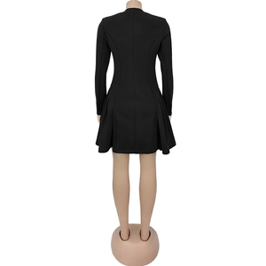 Detailed view of women's black long sleeve mini dress featuring a pleated skirt and slim fit