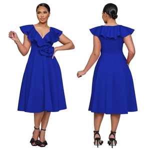 Detail of royal blue cocktail dress featuring V-neck, ruffle shoulders and floral waist decor