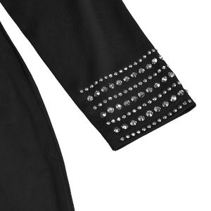 Detail shot of elegant black slim-fit dress featuring rows of shimmering silver rhinestones