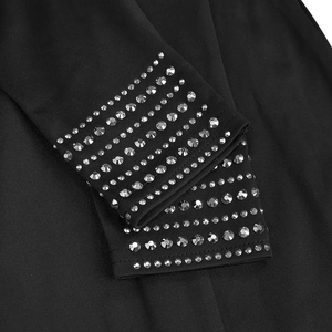 Detail view of black dress sleeve cuff featuring eight rows of shimmering silver rhinestones