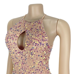 Macro detail of sequined halter top with keyhole cutout and iridescent round sequins
