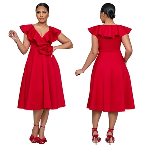 Detail of red elegant high waist dress with large side flower and ruffle neckline