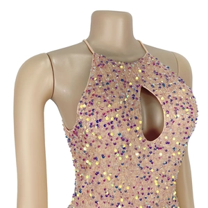 Detail of sequined halter neck dress with oval cutout and colorful shimmering sequins