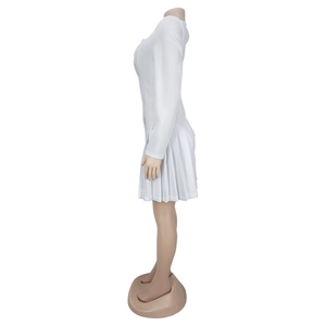 Detailed side view of white V-neck long-sleeve pleated dress with a mini ruffled hemline