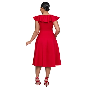 Detail view of the back of a red high-waisted dress with ruffles and a smooth silhouette