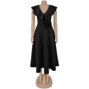 Close-up of elegant black V-neck midi dress featuring layered ruffles and a 3D waist flower