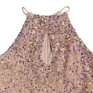 Detail of sequin evening dress featuring halter neck and a teardrop cutout neckline