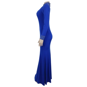 Close-up of royal blue turtleneck fishtail dress featuring sparkling rhinestone details