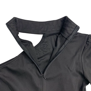 Detail of elegant black off-shoulder dress with hollow neckline and invisible back zipper