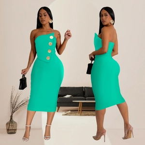 Detail of mint green tube dress featuring asymmetric neckline and gold buttons