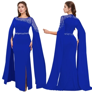 Detail of royal blue evening gown featuring rhinestone embellishments and cape sleeves