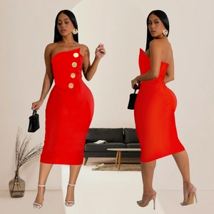 Detail of red tube dress with asymmetric neckline and decorative gold metal buttons