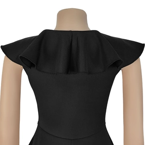 Detailed back view of an elegant black dress featuring a dramatic ruffle cape collar