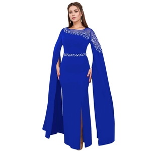 Detail of royal blue evening gown with pearl embellishments and cape sleeves