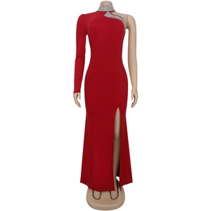 Detail of red off-shoulder dress featuring silver rhinestone trim and high side slit