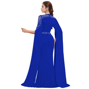 Detailed back view of royal blue evening gown with cape sleeves and pearl embellishments