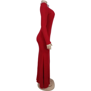 Detailed view of red long sleeve dress with silver rhinestone collar and front split hem