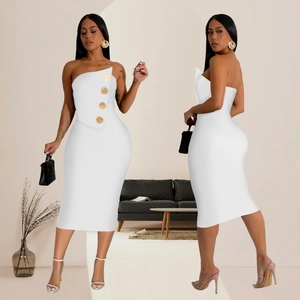 Detail of white strapless bodycon midi dress with golden buttons and asymmetric neckline