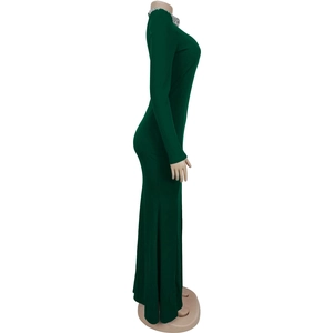 Detailed view of dark green bodycon dress featuring rhinestone embellishments on neckline